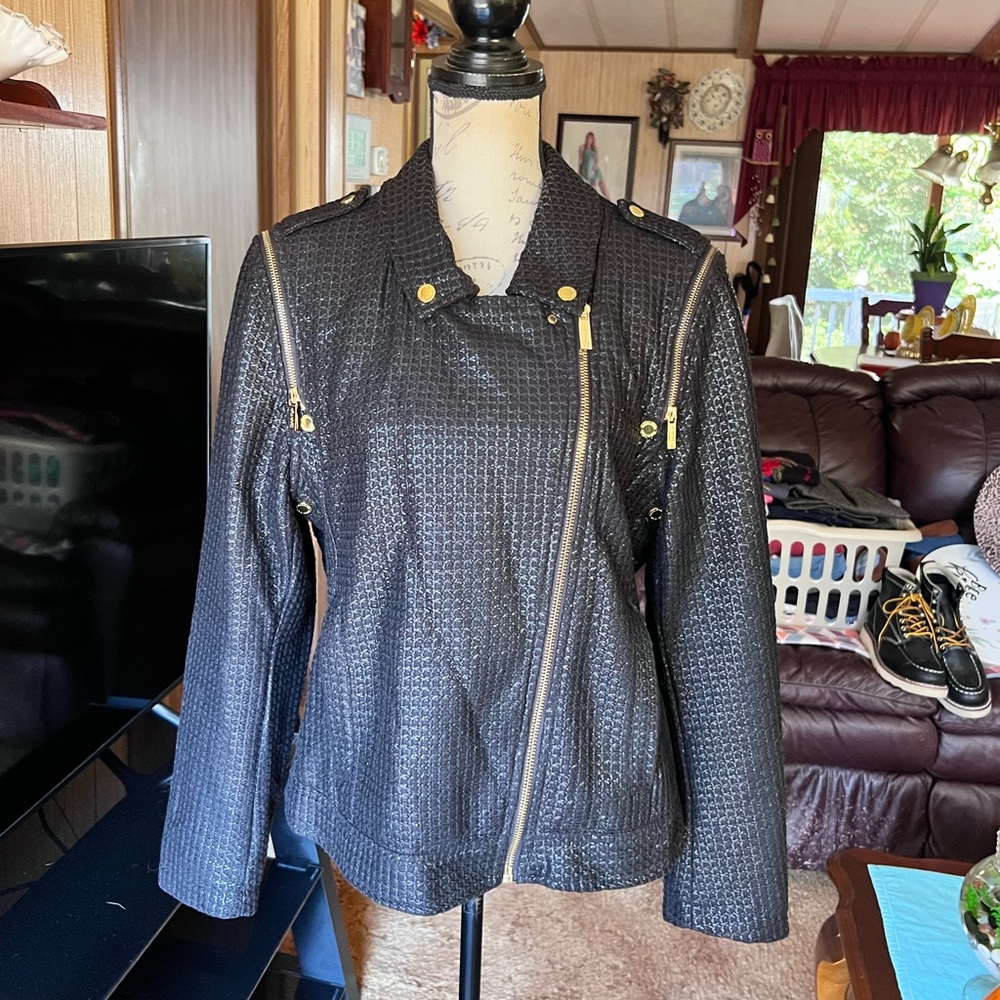 Woman’s Calvin Klein black shiny fabric moto jacket with gold tone hardware.
